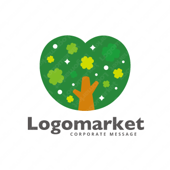 木とクローバーと幸せのロゴ