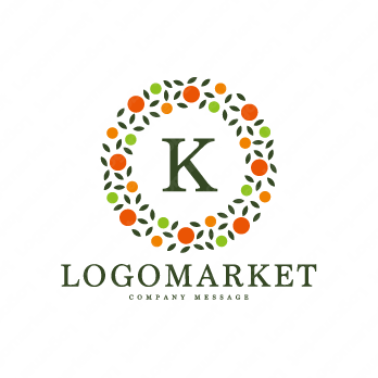 Kとオレンジと植物のロゴ