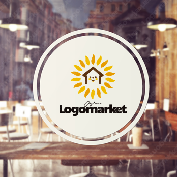 家と太陽と花のロゴ