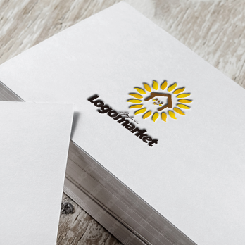 家と太陽と花のロゴ