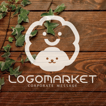 くもと犬とキャラクターのロゴ