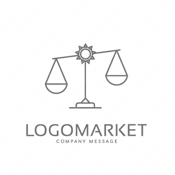 天秤と太陽とシンプルのロゴ