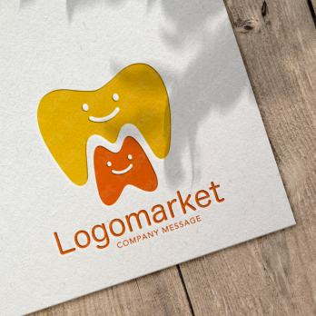 歯と親しみやすいとMのロゴ