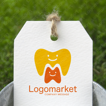 歯と親しみやすいとMのロゴ