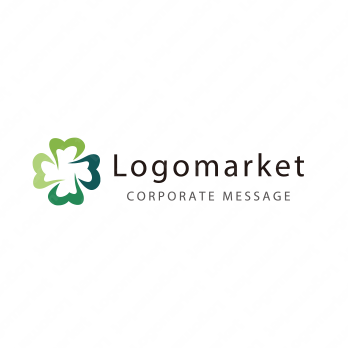 四葉のクローバーと歯と優しさのロゴ